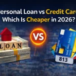 Comparison of personal loan and credit card interest rates shown on a calculator with Indian rupee notes.